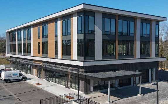 An exterior view of a rectangular building.