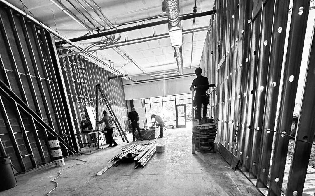 A black-and-white view of an interior being worked on.