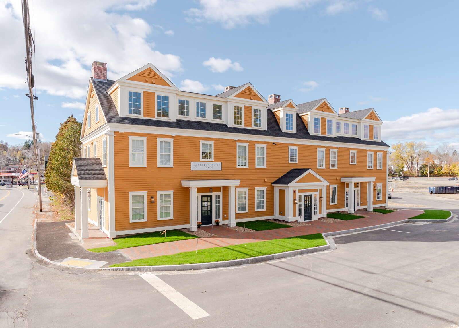 an orange mixed-use apartment building