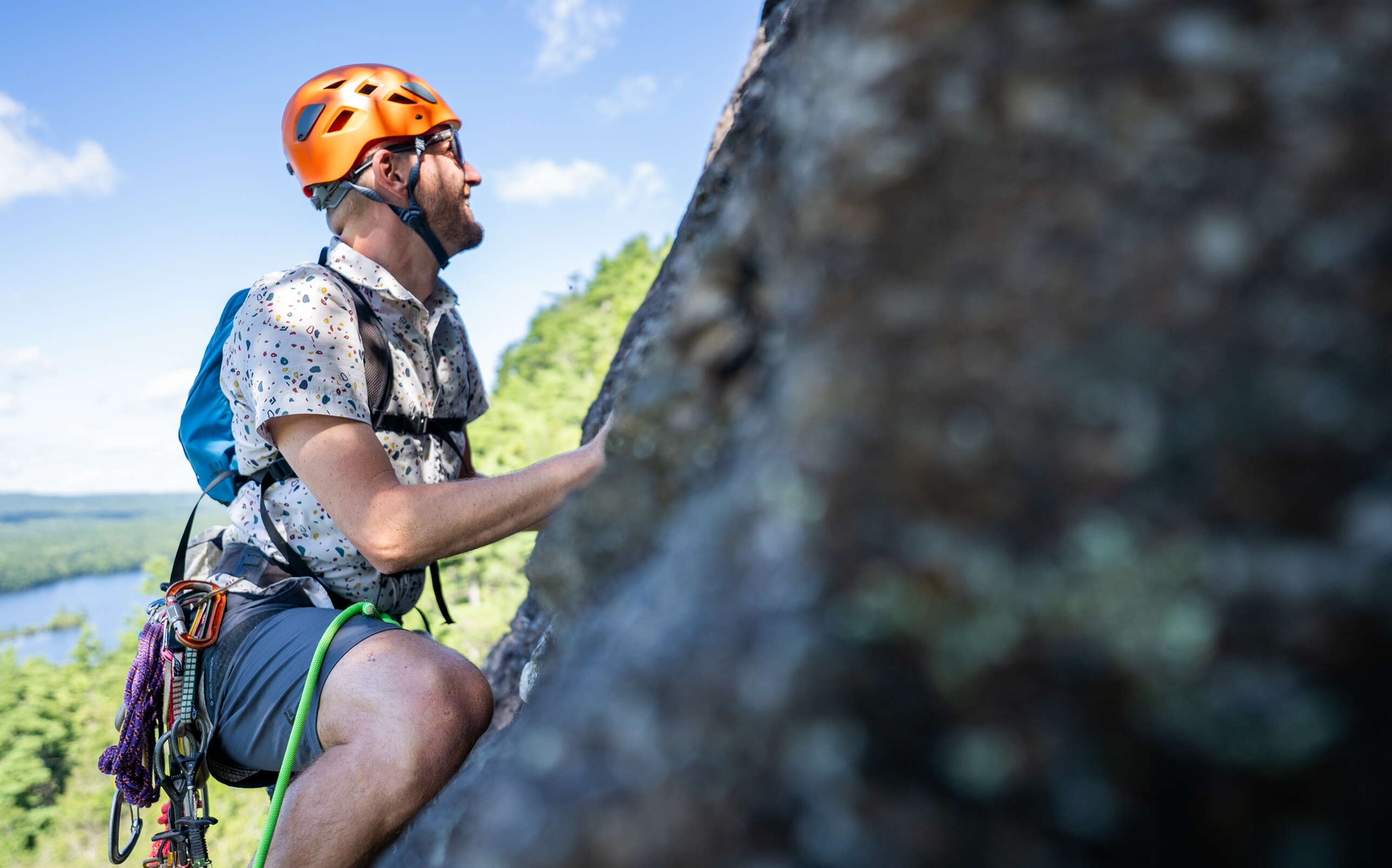 A person climbs a rock face.