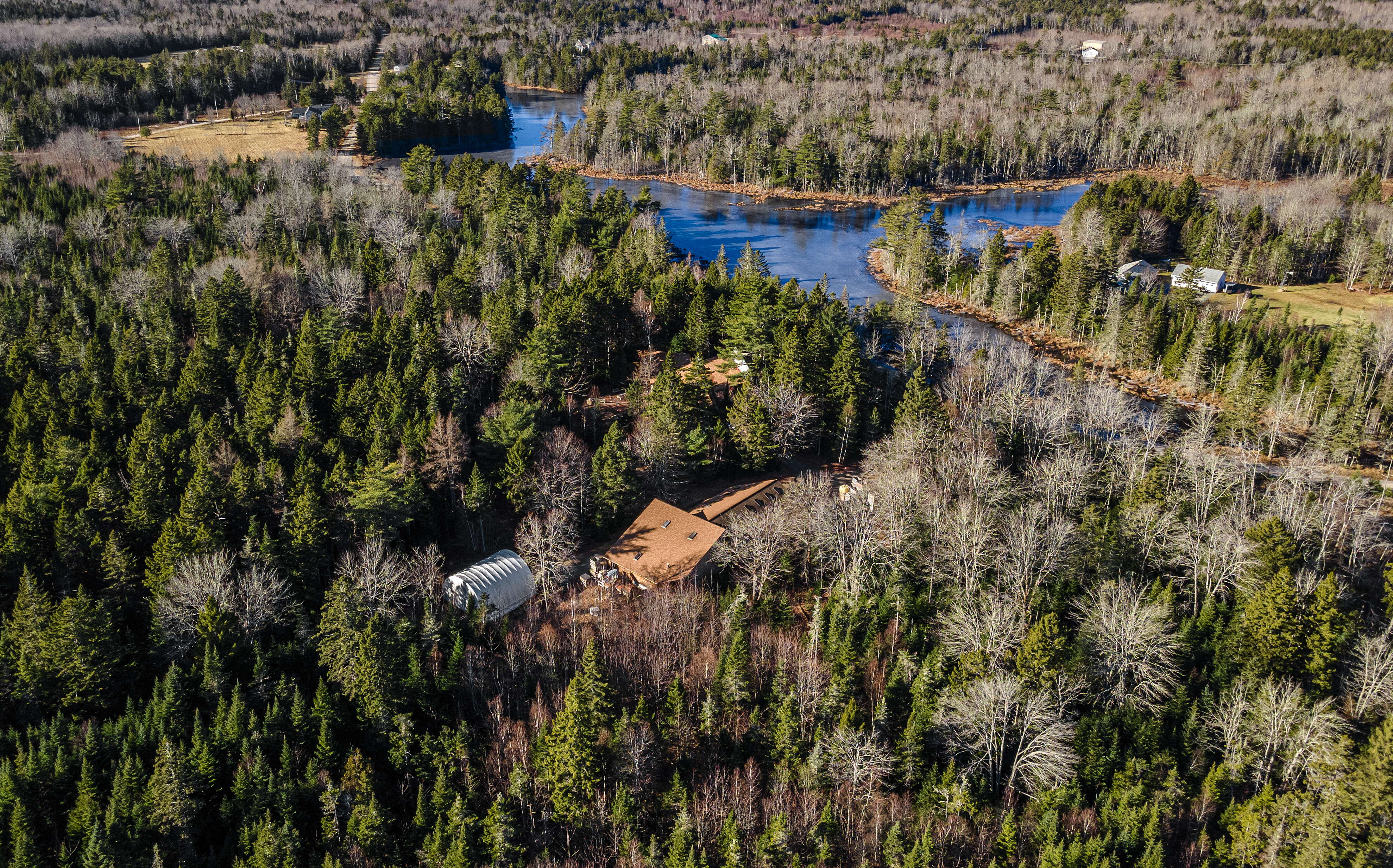 An aerial view of buildings and woods