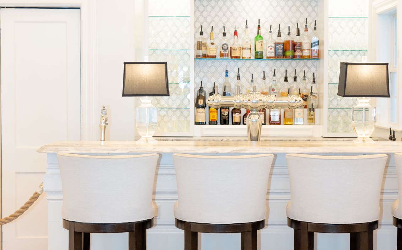A room is mostly full of white paint and furnishings.
