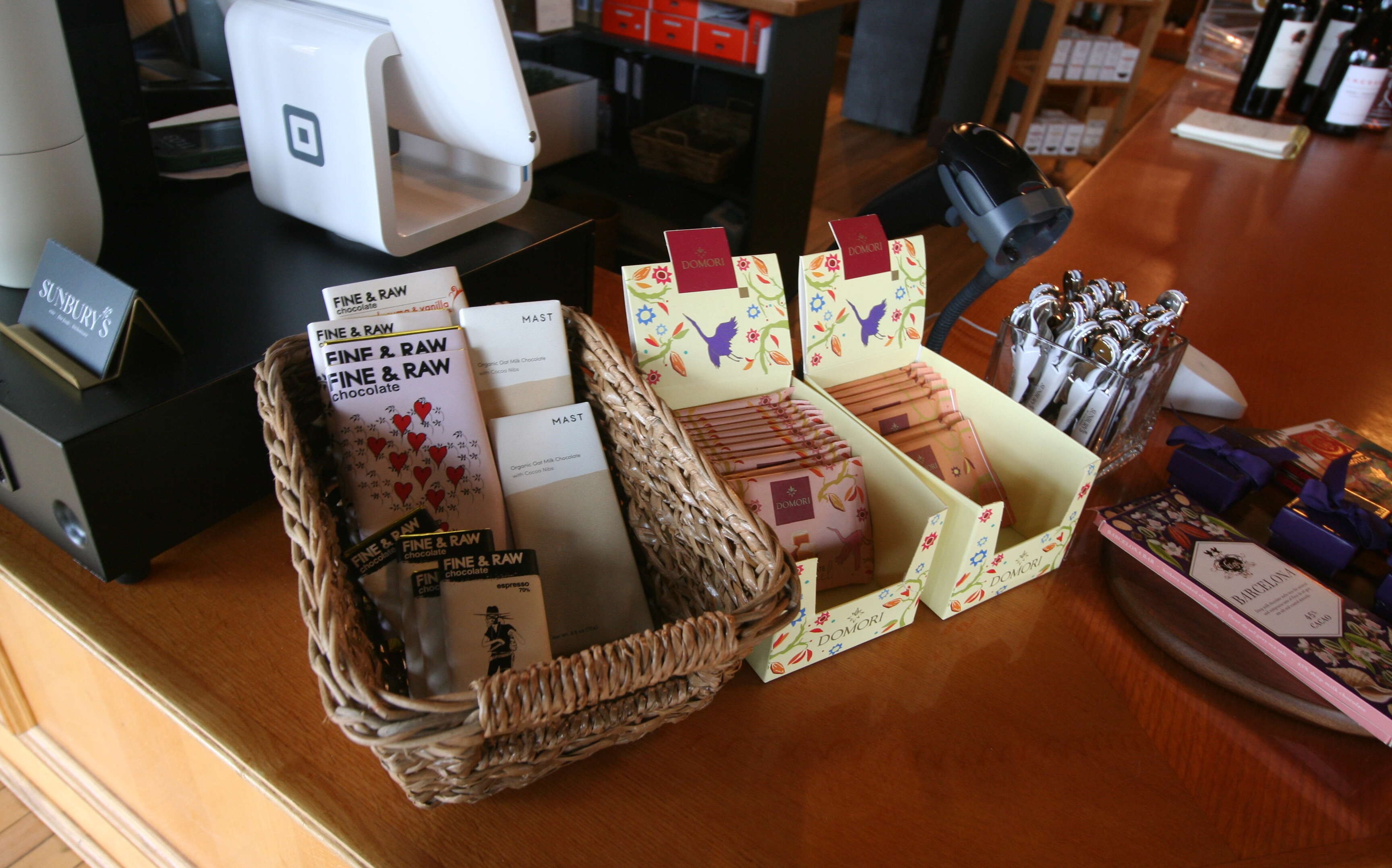 Baskets hold foodstuffs on a counter.