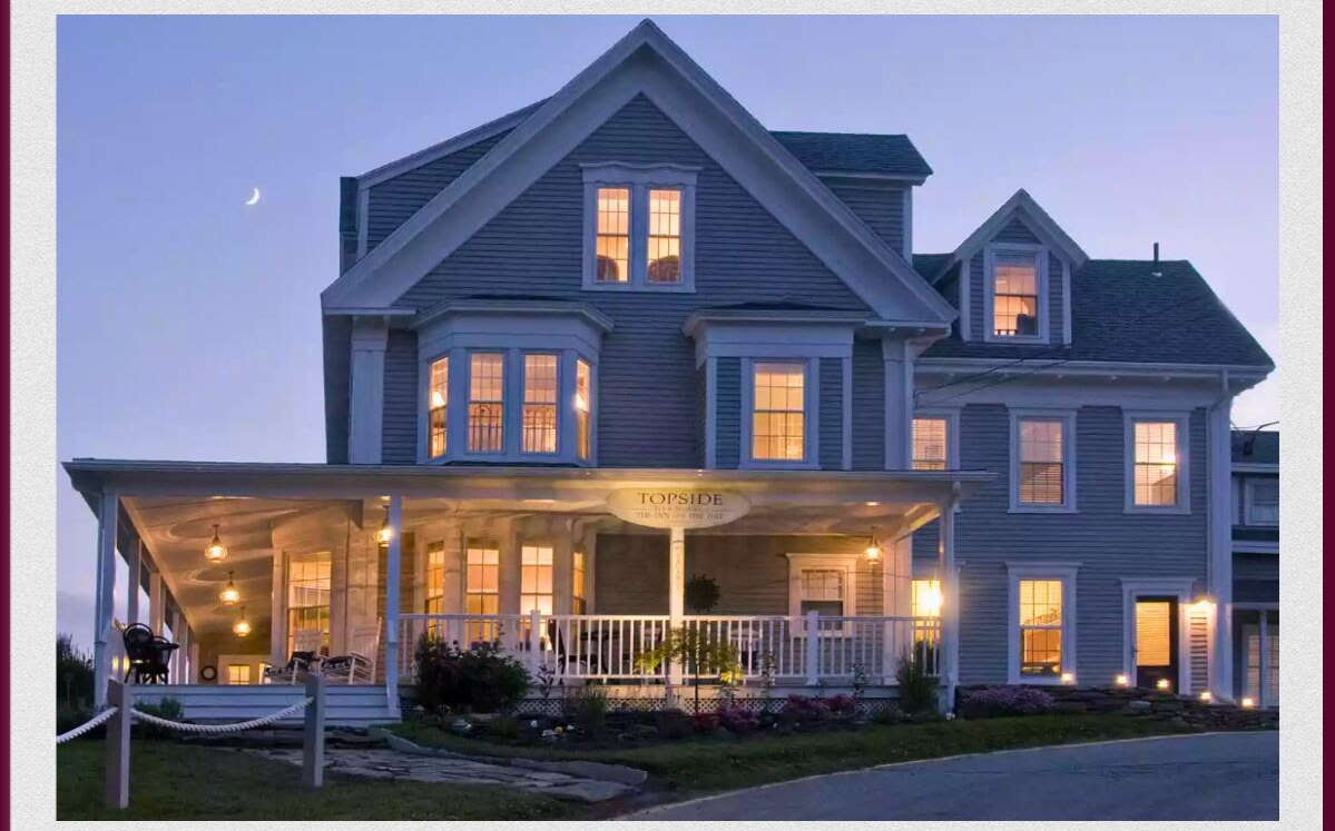 A buliding has lights on inside.