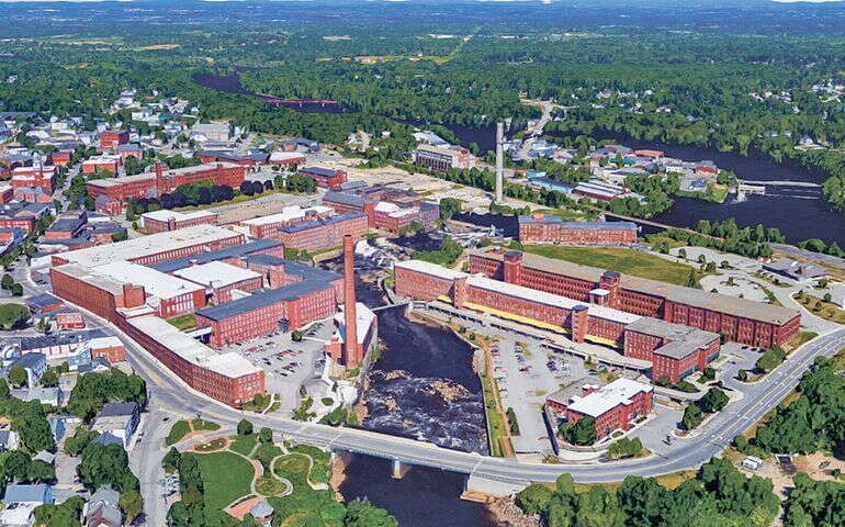 An aerial view shows a lot of brick buildings.