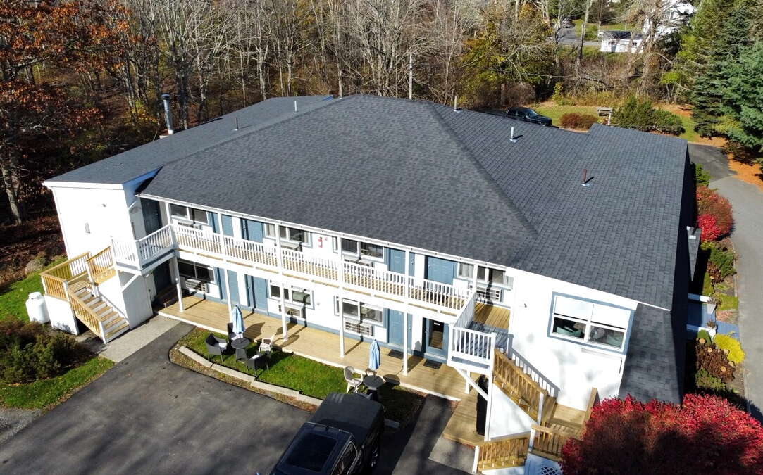 An aerial view shows a two-story building.
