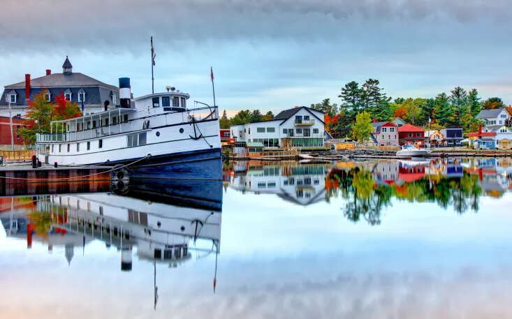 Boats, structures and water are very colorful.