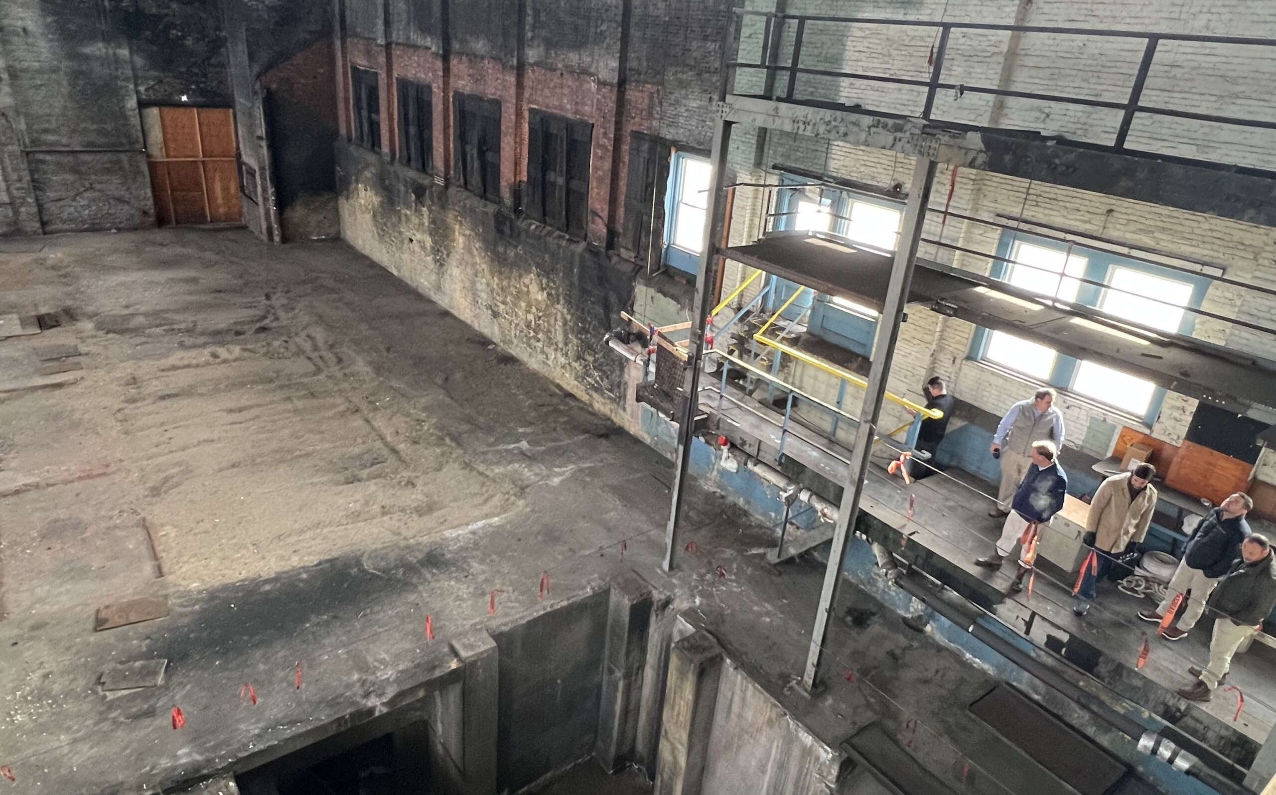 People look at disused industrial space.