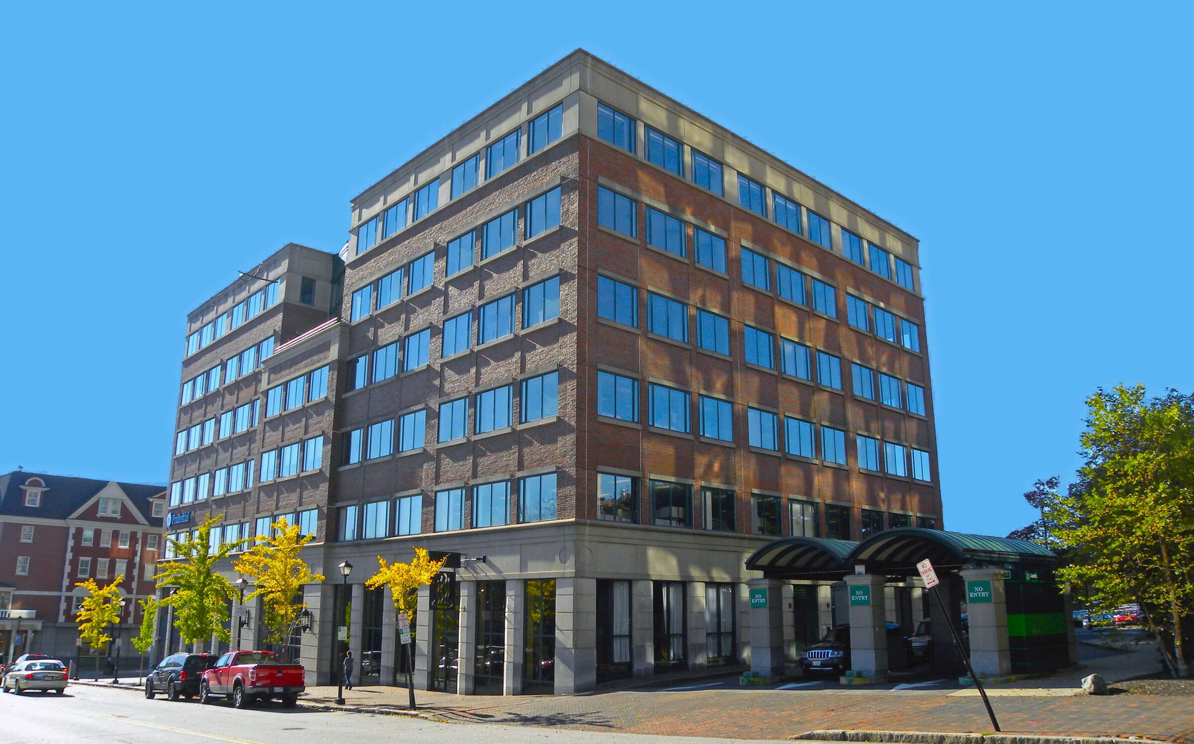 An exterior view shows a multi-story building.