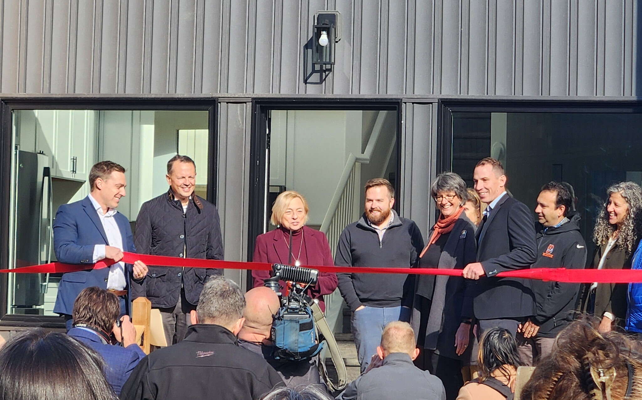 people at a ribbon cutting
