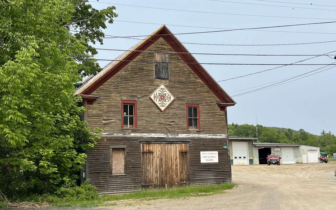 A building is sided in wood.