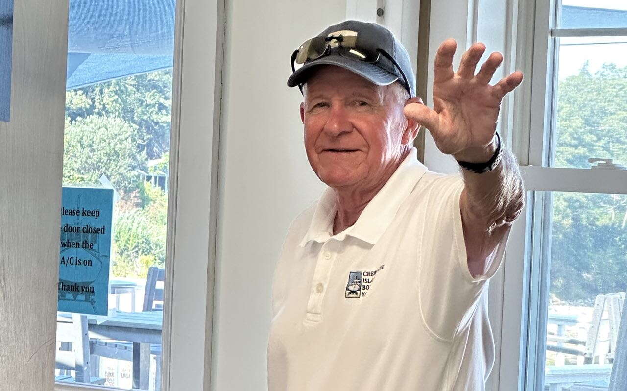 A person waves.