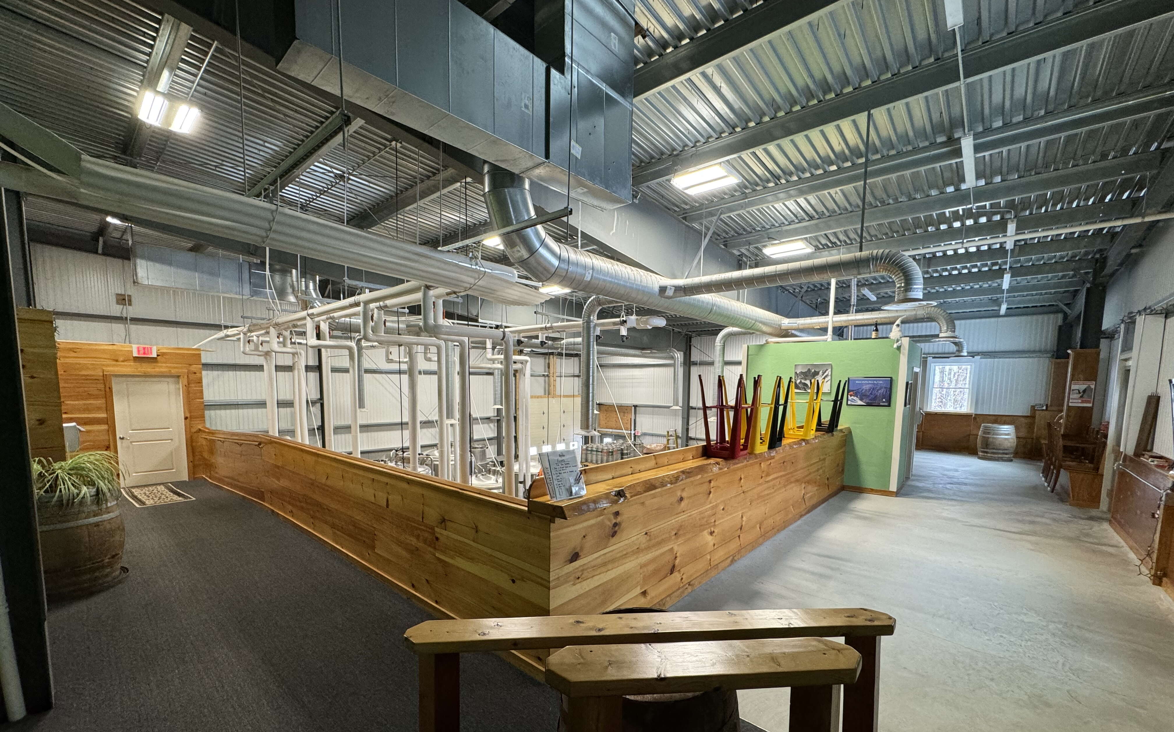 A view of a space with a counter and metal ceiling.