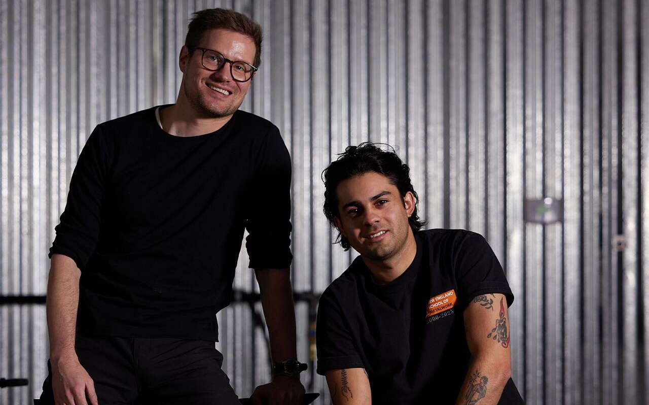 Two people pose for a photo.