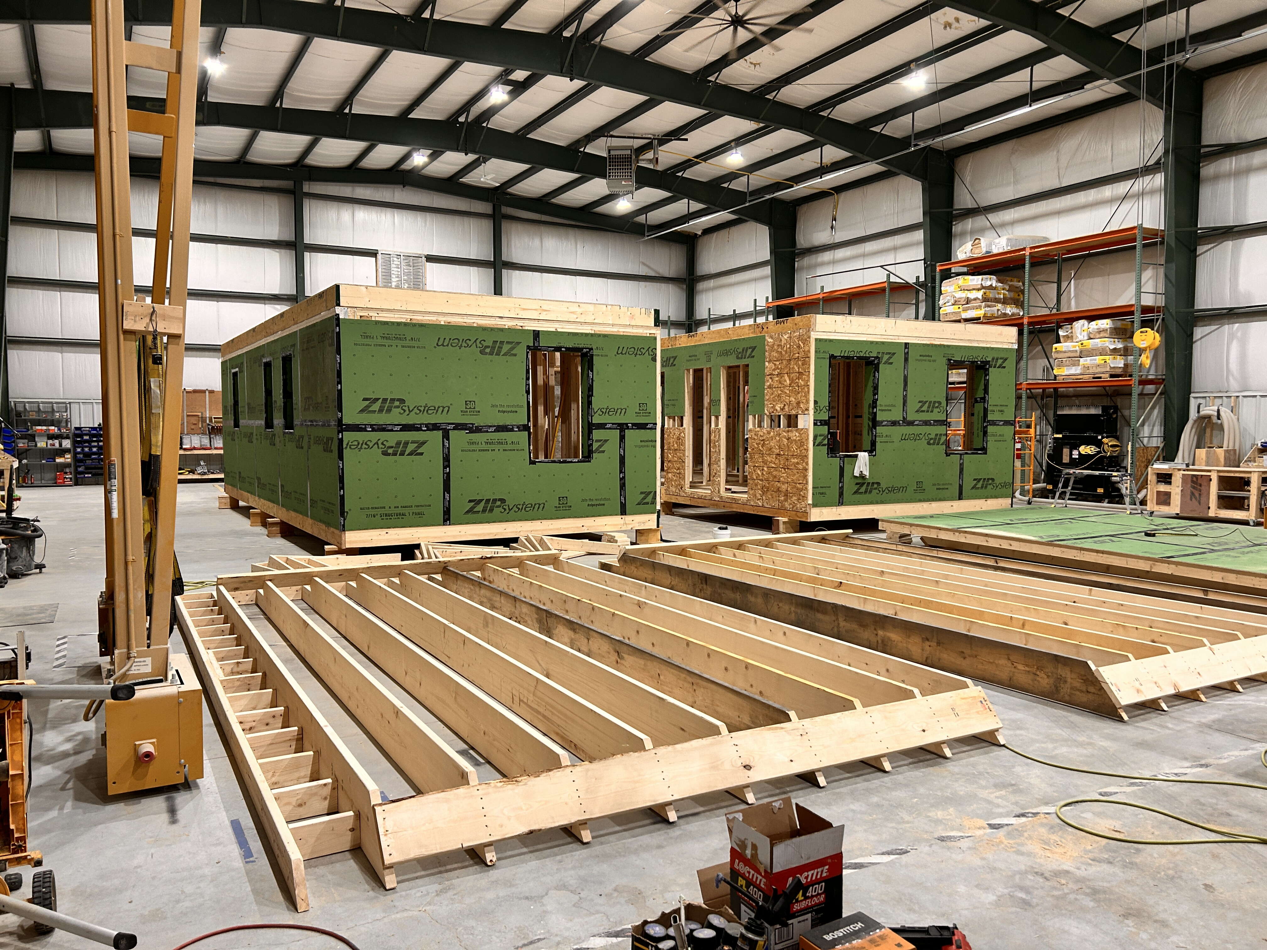 Wood panels and units are inside a large space.