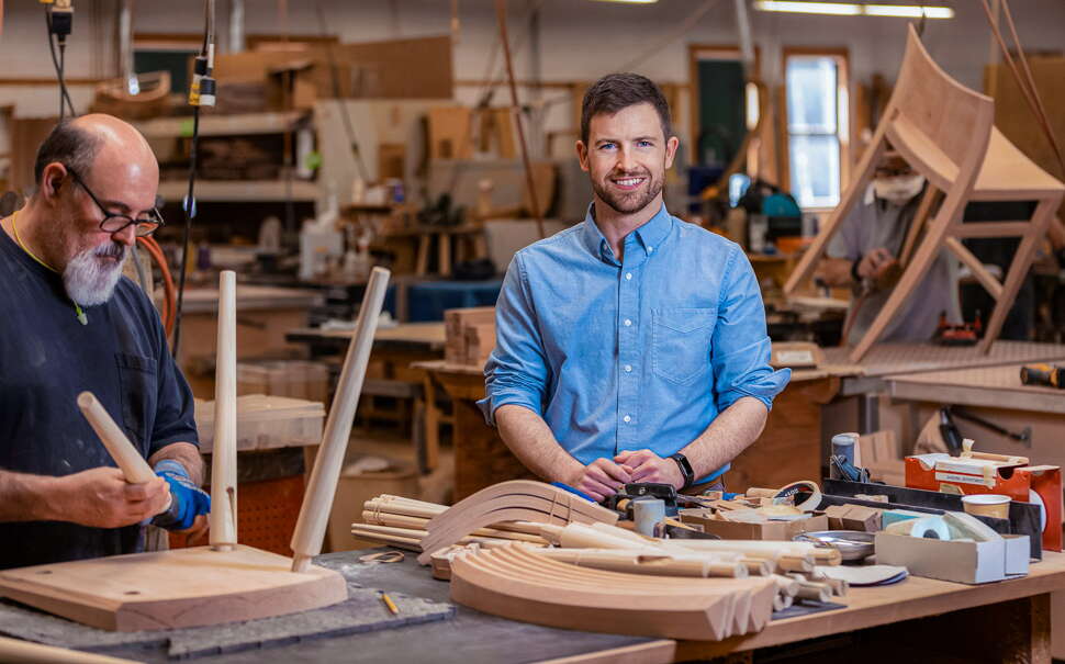 Philip Hussey and Mike Bomser of Thos. Mose, inside the shop.