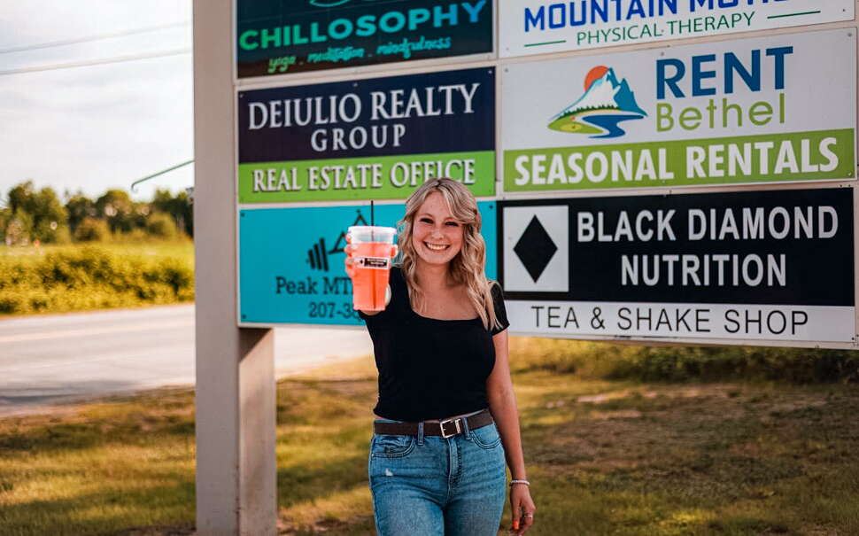 Maya Taylor of Black Diamond Nutrition holding a drink 