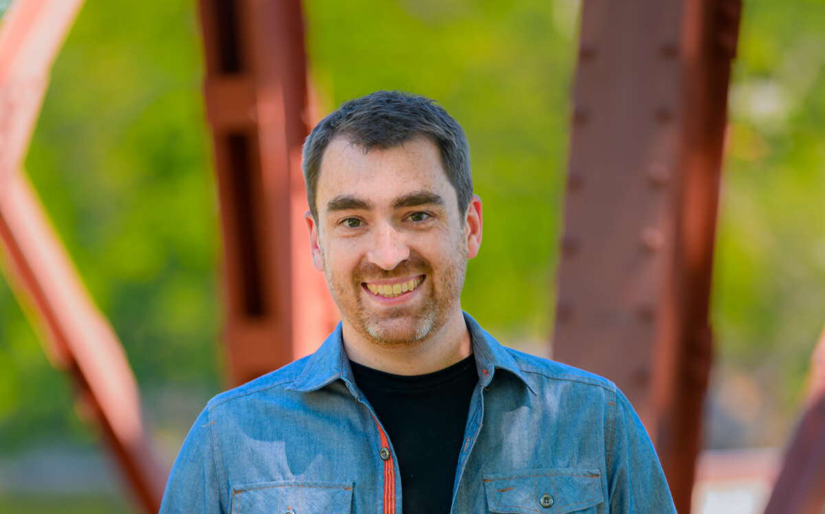 Nate Wildes standing with hands in pockets