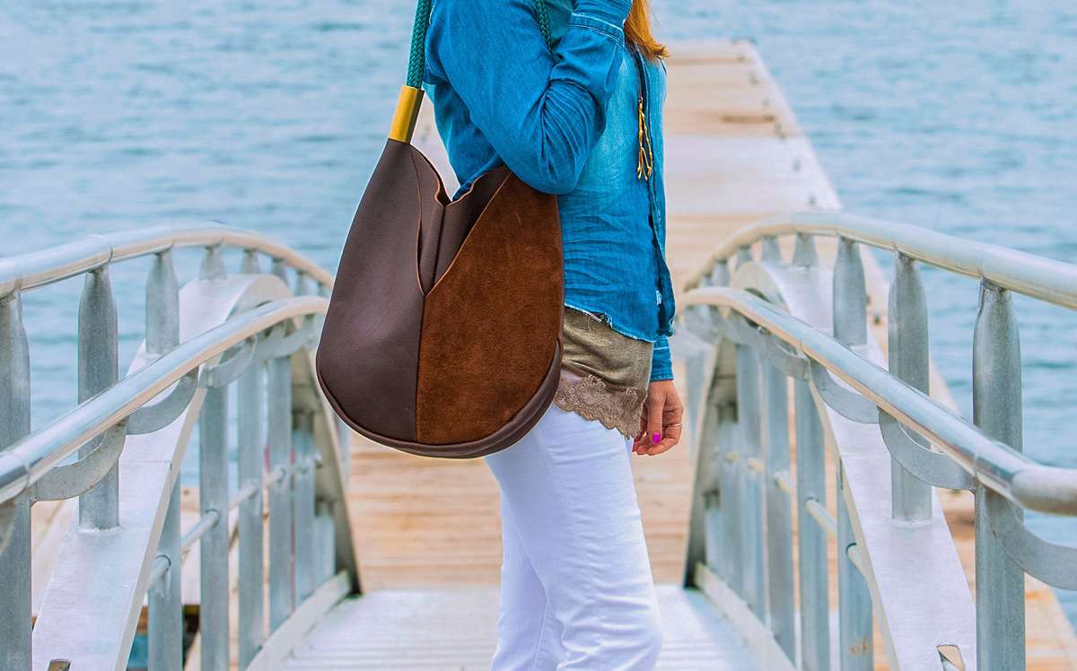 Becky McKinnell standing outdoors with one of her handbags on her shoulder