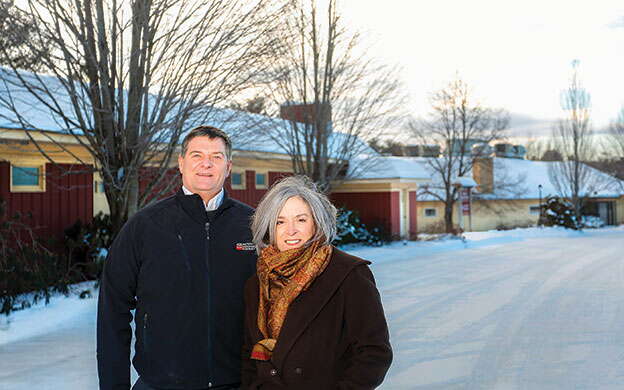 Lincoln Merrill and Denise Clavette outdoors in winter. 