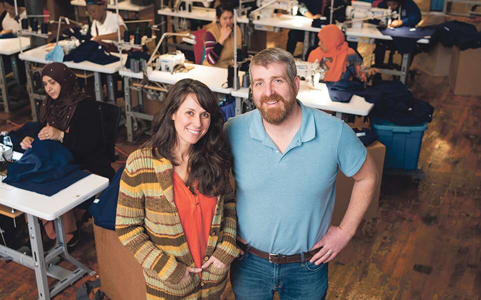 Ben Waxman and Whitney Reynolds at American Roots in Westbrook, with the factory in the background