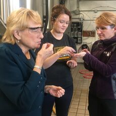 Gov. Janet Mills with two Maine brewers who are also state lawmakers.