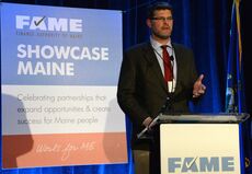 Dana Doran accepts award for Professional Logging Contractors of Maine