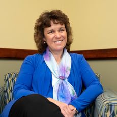 Laurie Lachance seated in her office