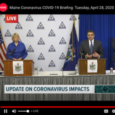 Dr. Shah at the podium, six feet to the right of Gov. Janet Mills, at Tuesday's press conference.