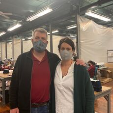 Ben Waxman and Whitney Reynolds at American Roots in Westbrook with face masks on.