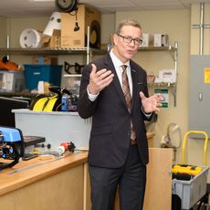 UNE President James Herbert in the Makerspace lab at the school's Biddeford campus