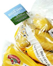 A bag of yellow potatoes with a Hannaford Supermarkets label also has a small attached label that says green thumb farms Queen Anne
