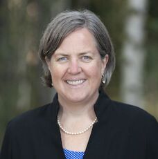 person smiling with necklace