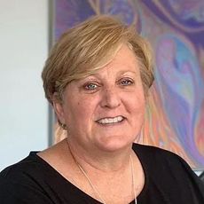 Portrait of blond woman in black dress