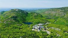 aerial of campus and woods