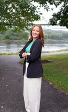 person with red hair on paved path