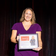 Woman holding award