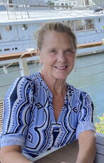 person sitting in patterned blue top