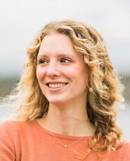person in orange blouse