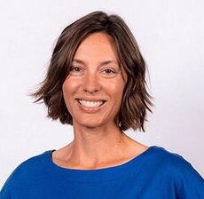 person in blue scoop-neck blouse