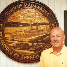 Town manager by town emblem