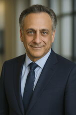 A person poses for a headshot.