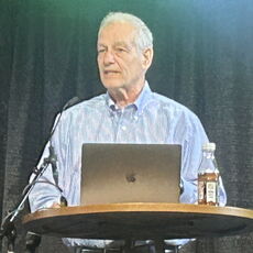 Joe Edwards on stage at the Maine manufacturing summit
