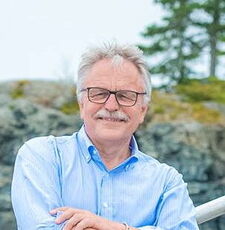 A person poses for a headshot.