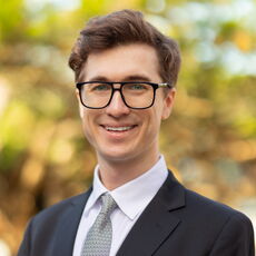 A person poses for a headshot.