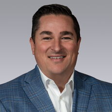 A person poses for a headshot.