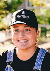 A person poses for a headshot.