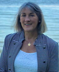 A person poses for a headshot.