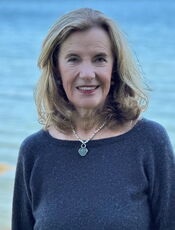 A person poses for a headshot.