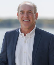 A person poses for a headshot.